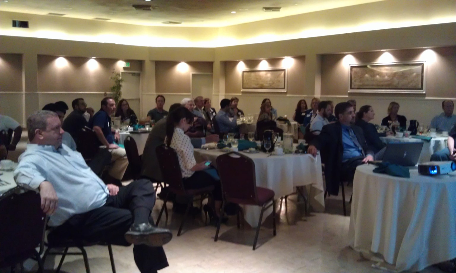 Attendees seated at a TRE-related presentation or meeting.