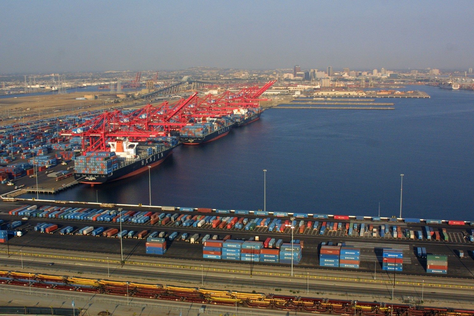 Container ships berthed at a major port terminal.