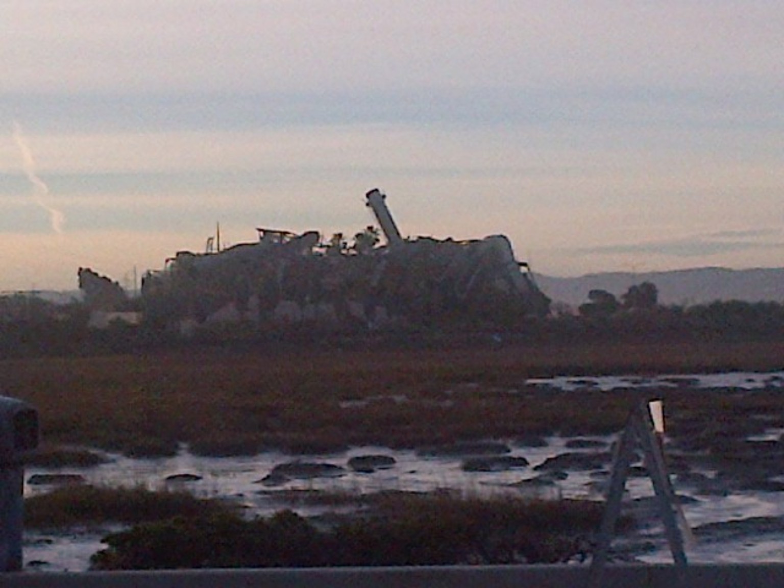 Wetlands restoration or field project at dusk.